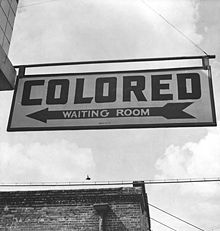 http://upload.wikimedia.org/wikipedia/commons/thumb/e/e0/1943_colored_waiting_room_sign.jpg/220px-1943_colored_waiting_room_sign.jpg