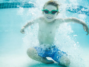 kid-swimming-under-water