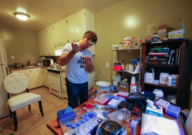 scientist josiah zayner, 34, pipettes solutions for bacterial engineering in his home lab in burlingame, calif., on tuesday, dec. 15, 2015. (john green/bay area news group)