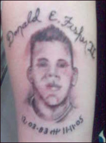 this tattoo of donald e. fisher ii is on his mother\'s right forearm.