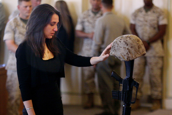 stephanie jacobs pays her respects to her fiancee, staff sgt aaron j. taylor during a memorial service in the chapel at camp pendleton on october 28, 2009 in oceanside, california. staff sgt. taylor was killed while supporting combat operations in afghanistan.