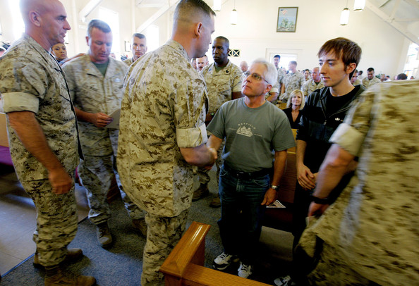 marines pay their respects to clifford taylor during a memorial service for his son, staff sgt. aaron j. taylor in the chapel at camp pendleton on october 28, 2009 in oceanside, california. staff sgt. taylor was killed while supporting combat operations in afghanistan.