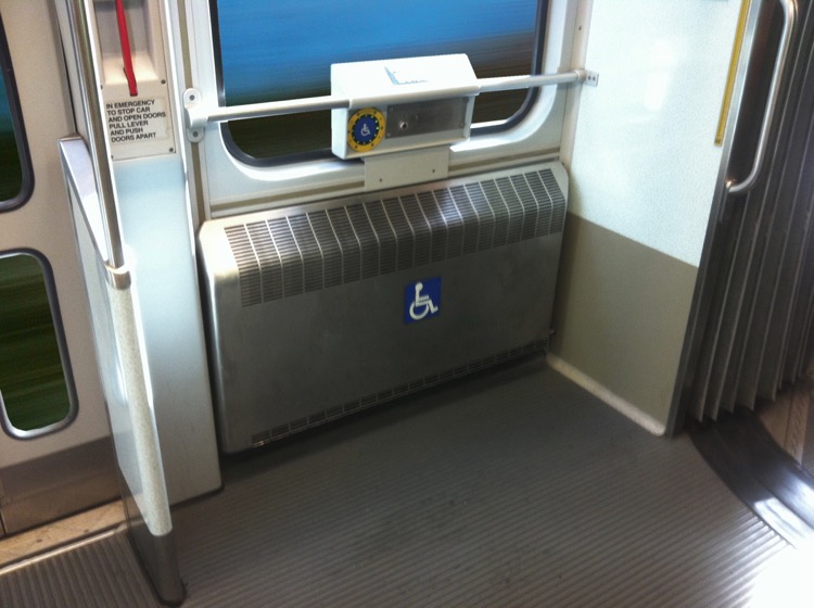 photograph of clear area for wheelchairs and other mobility devices in a light rail vehicle