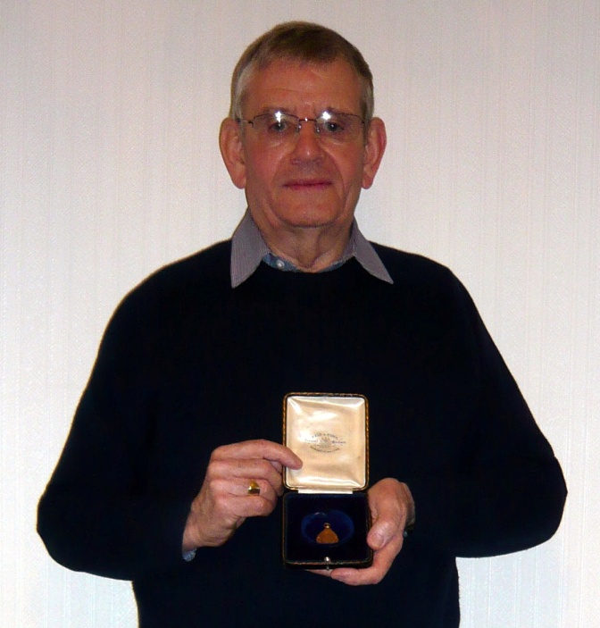 tom duffy with fathers medal cropped.jpg
