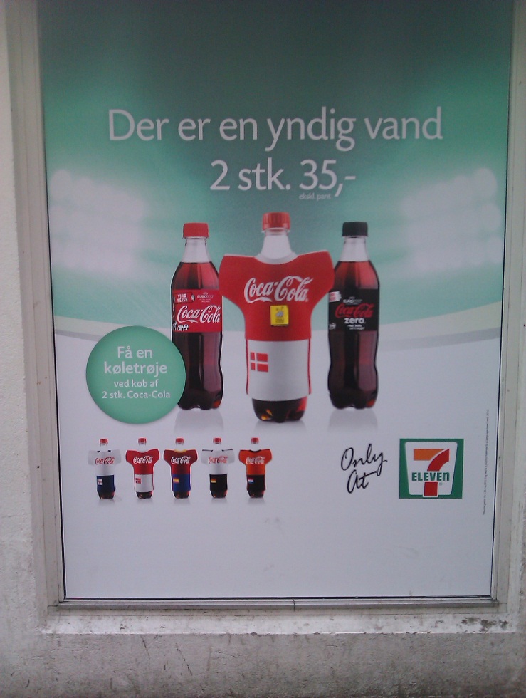 c:\users\tim\desktop\appendices\promotional images used in the first three interviews\coca-cola promotional poster at 7-11 for 2 bottle offer with \'cooler\' kits.jpg