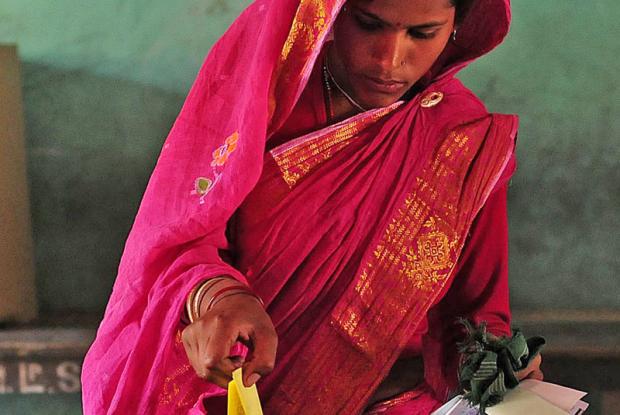 a woman casting her vote in panchayat elections in assam on 6 february. 