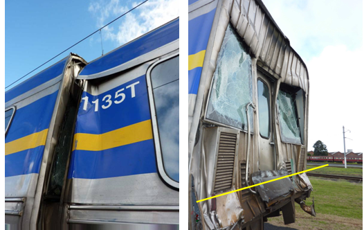 photograph of car 1135t impact on 661m and evidence of override crease in 661m (right).