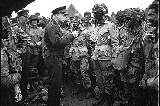 supreme allied commander u.s. army gen. dwight d. eisenhower speaks with 101st airborne division paratroopers before they board airplanes and gliders to take part in a parachute assault into normandy as part of the allied invasion of europe on d-day, june 6, 1944. 