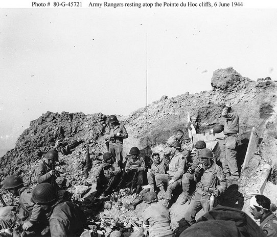 u.s. army rangers rest atop the cliffs at pointe du hoc, which they stormed in support of omaha beach landings. the photograph was released on june 12, 1944.