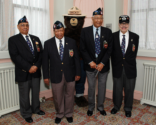 former members of the 555th parachute infantry regiment smoke jumpers, l to r sergeant clarence h. beavers, national triple nickles association president joe murchison, smokey bear, first sergeant walter morris and lt. col roger s. walden. the smoke jumpers visited the u. s. forest service in washington, d. c., on march 26, 2010. 