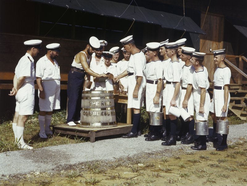 brfx38 a petty officer keeps tally of rum and water issued to each seaman.