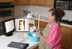 photo of an acrobat user reading a recipe from a cook book.
