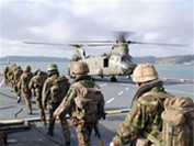 a coy, 40 commando embarking on a ch47 in plymouth sound